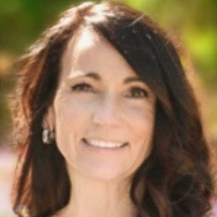 Portrait of Annie, a professional stylist at Visions Salon, showcasing their expertise and style.