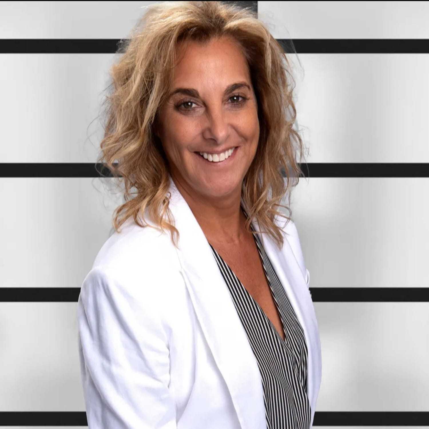 Portrait of Jodi, a professional stylist at Visions Salon, showcasing their expertise and style.