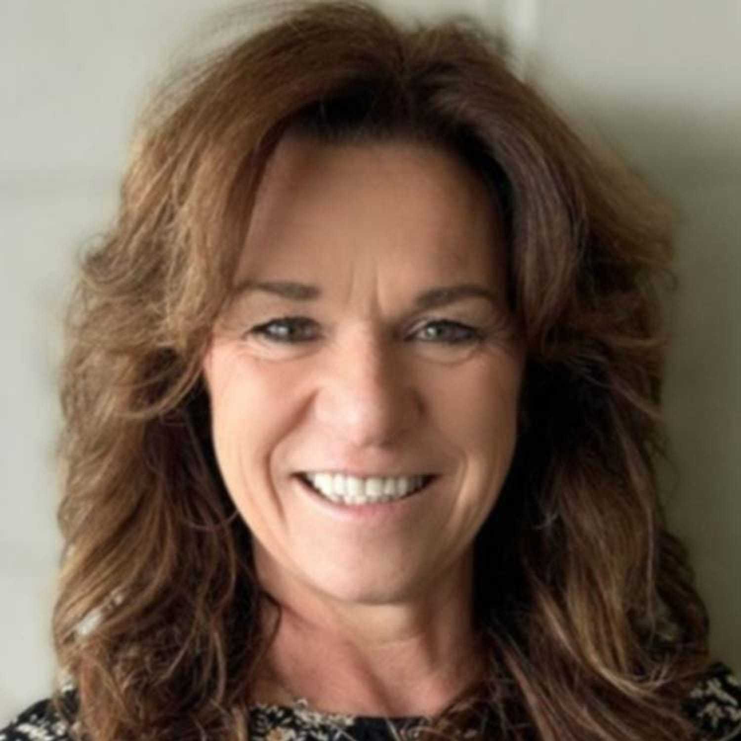 Portrait of Pammy, a professional stylist at Visions Salon, showcasing their expertise and style.