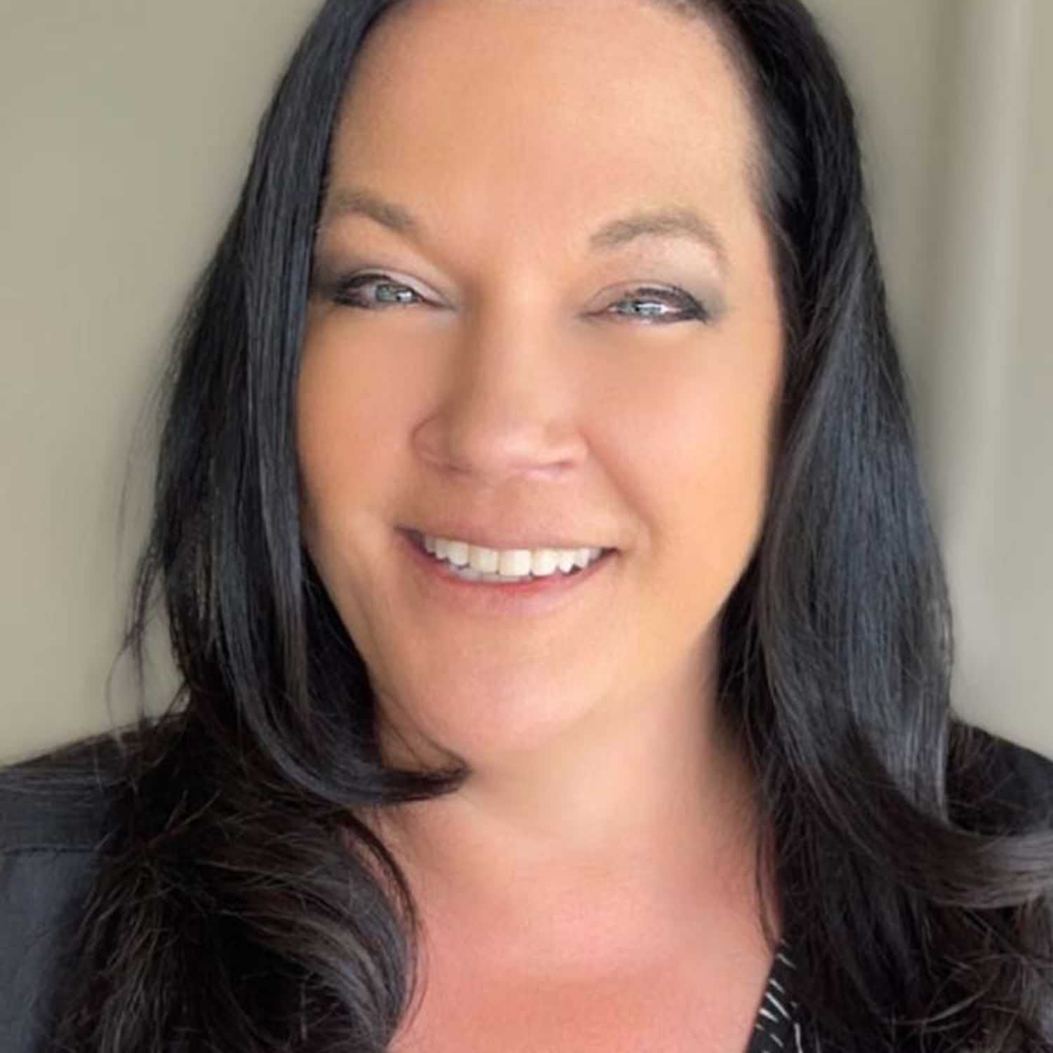 Portrait of Donna, a professional stylist at Visions Salon, showcasing their expertise and style.