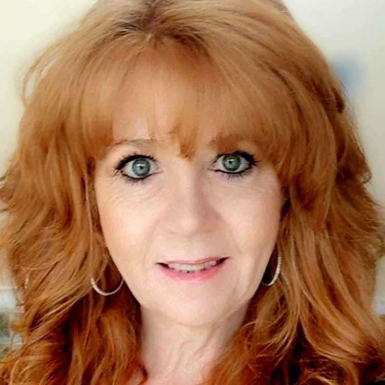 Portrait of Kerri, a professional stylist at Visions Salon, showcasing their expertise and style.