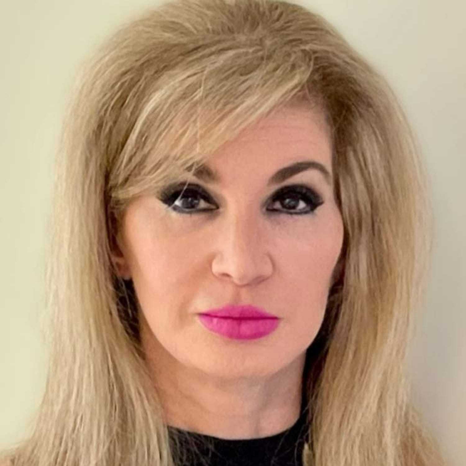 Portrait of Dawn, a professional stylist at Visions Salon, showcasing their expertise and style.